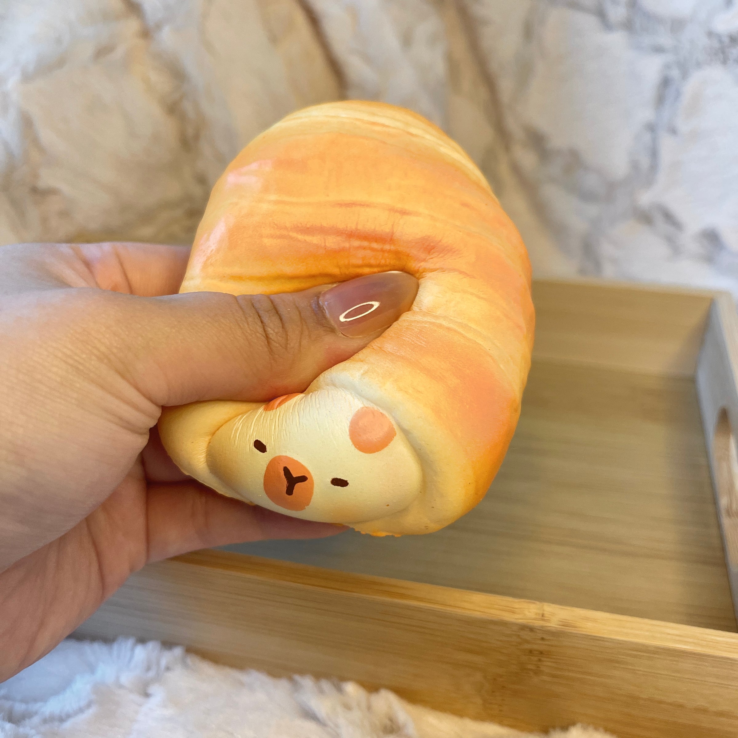 Capybara Cream Croissant squeezing or alternate view